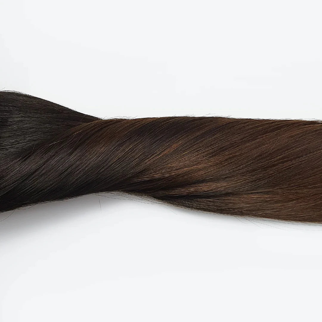 1 baans clip in hair, zwart naar bruine clip in extensions. Natural black to brown hairextensions met clips.