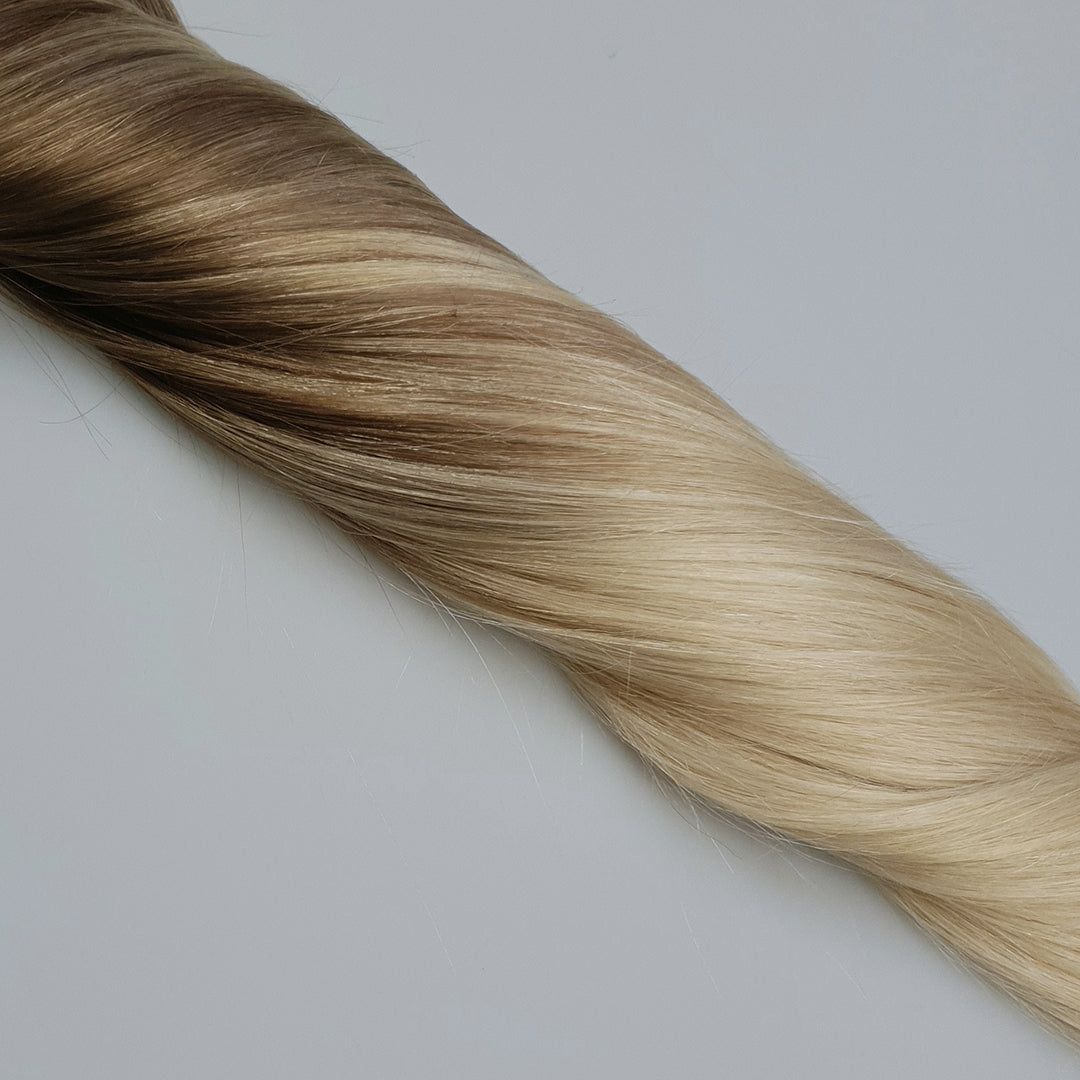 Goedkope real human hairextensions met een donkere aanzet en extra lichte punten. Een prachtige balayage die gemakkelijk blend met verschillende blondtinten.