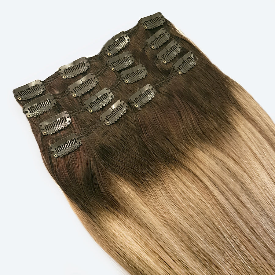 Deze set hairextensions bestaat uit prachtig glanzend, 100% remy human hair. Deze extensions blenden gemakkelijk met zowel ombre als balayage kapsels. Maar ook als je bruin haar hebt, kan je je haar te verlengen met deze clip-ins en creëer je gemakkelijk de trendy ombre look.