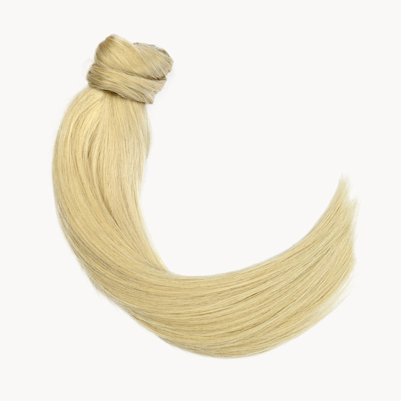Bleach blonde real human hair ponytail. Clip in paardestaart van echt haar met haarwikkel